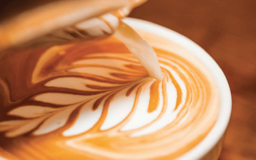 design of a leaf in the cup of coffee