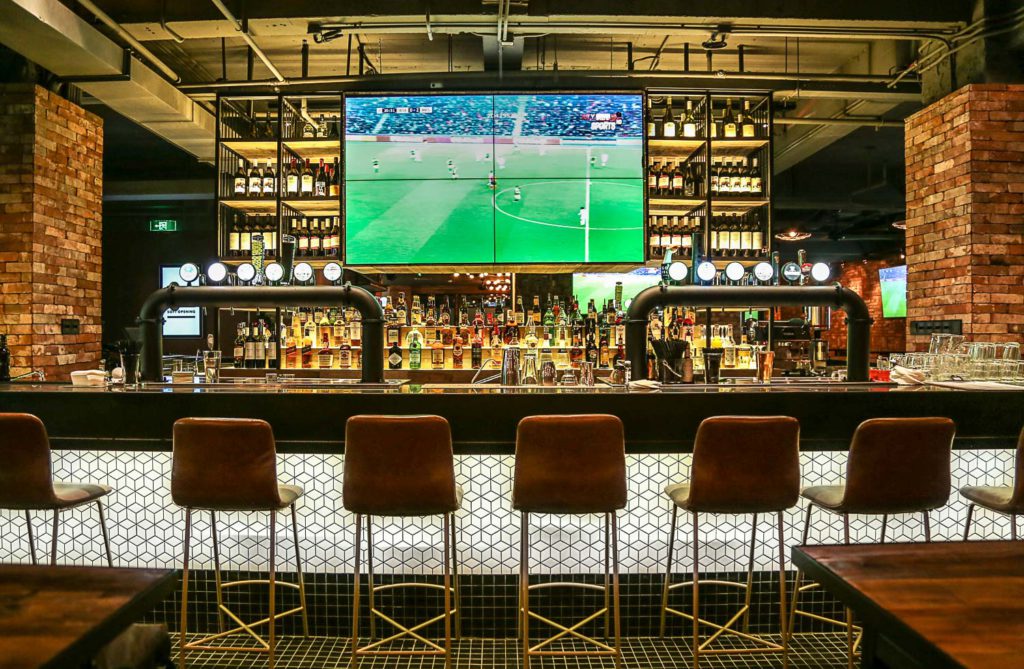 sports bar in medellin with soccer game on TV