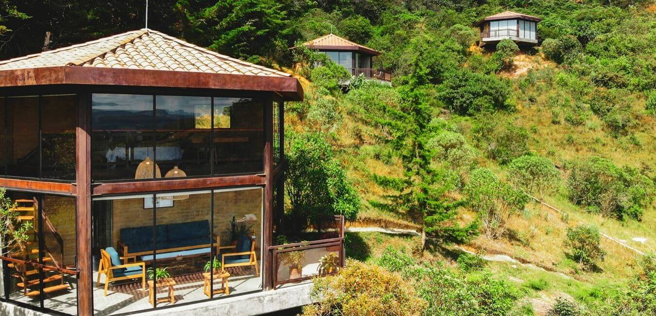 two-story glamping cabins with 360-degree glass windows