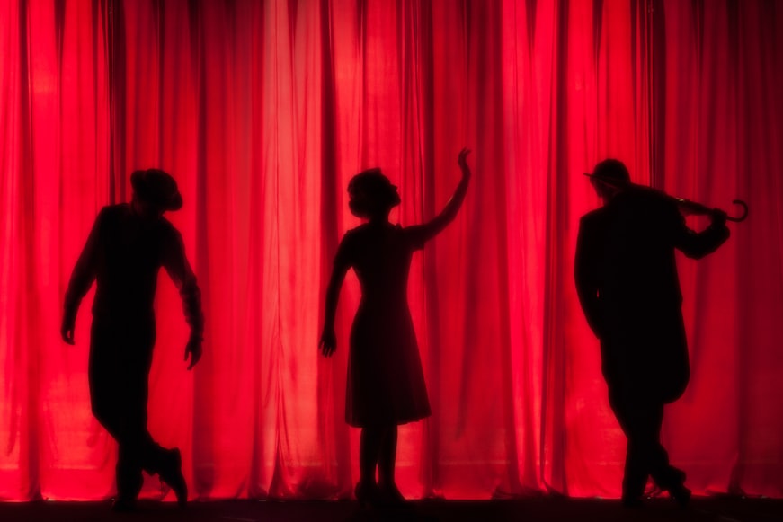 shadow reflection of three actors