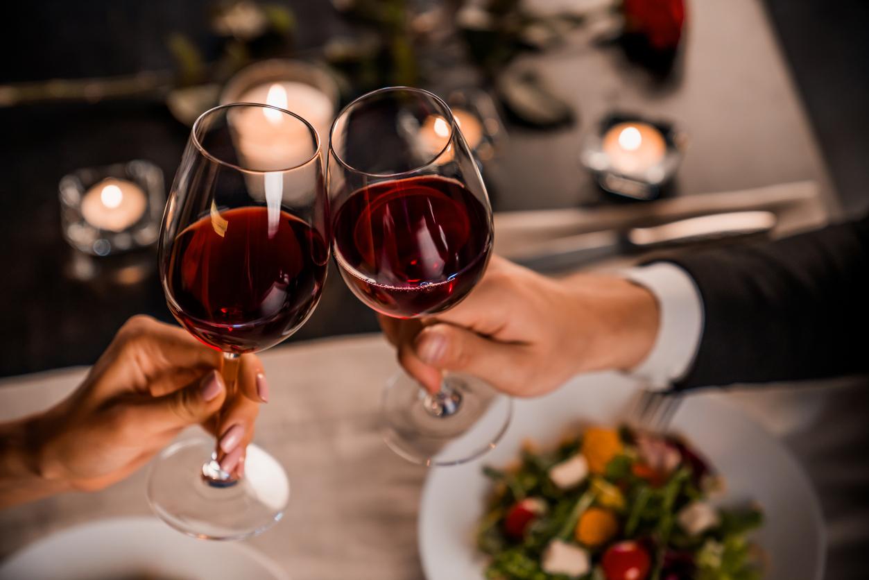 couple toasting with glasses of wine