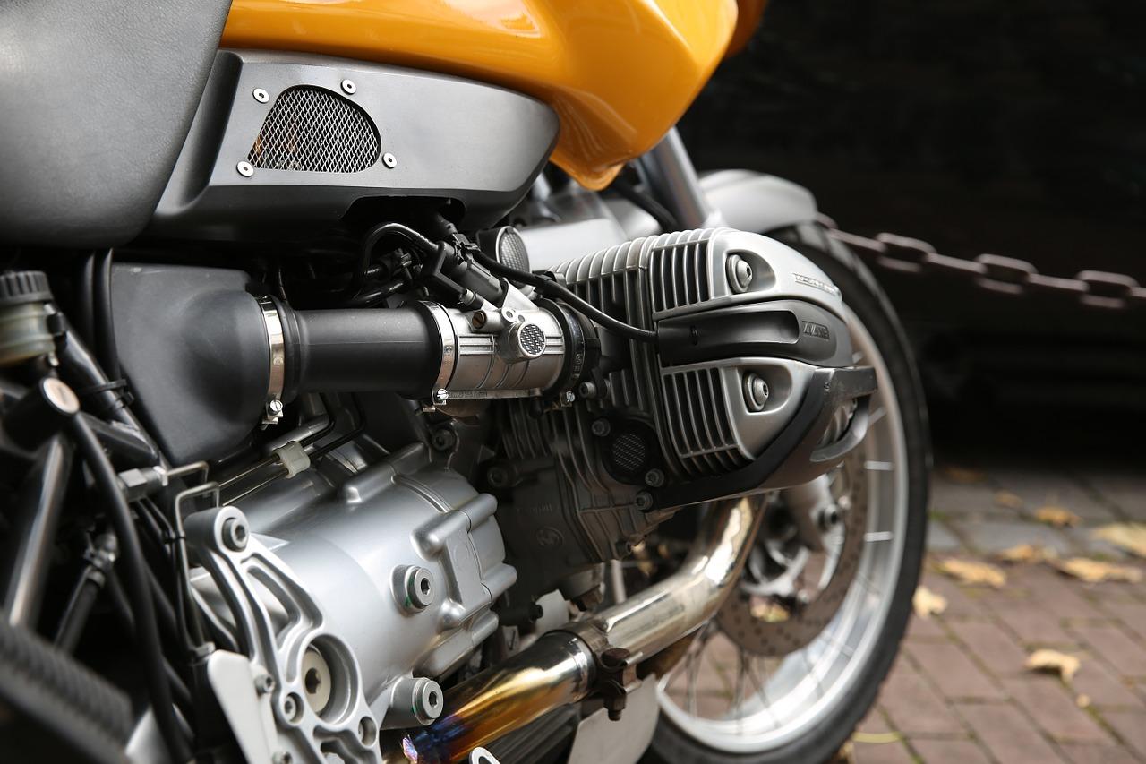 image of the engine of a yellow motorcycle