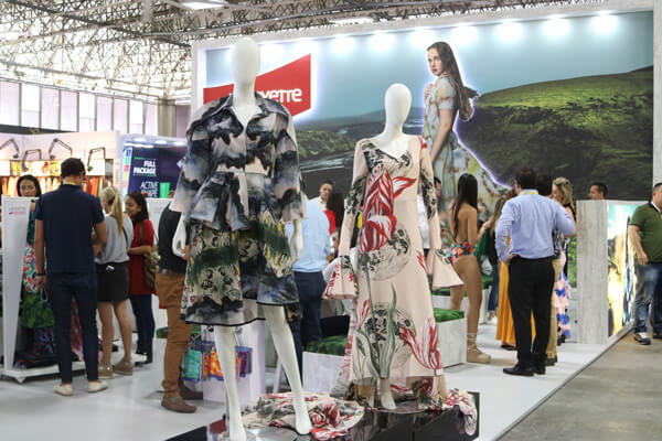 photo of the event where you can see the dresses made by the designers