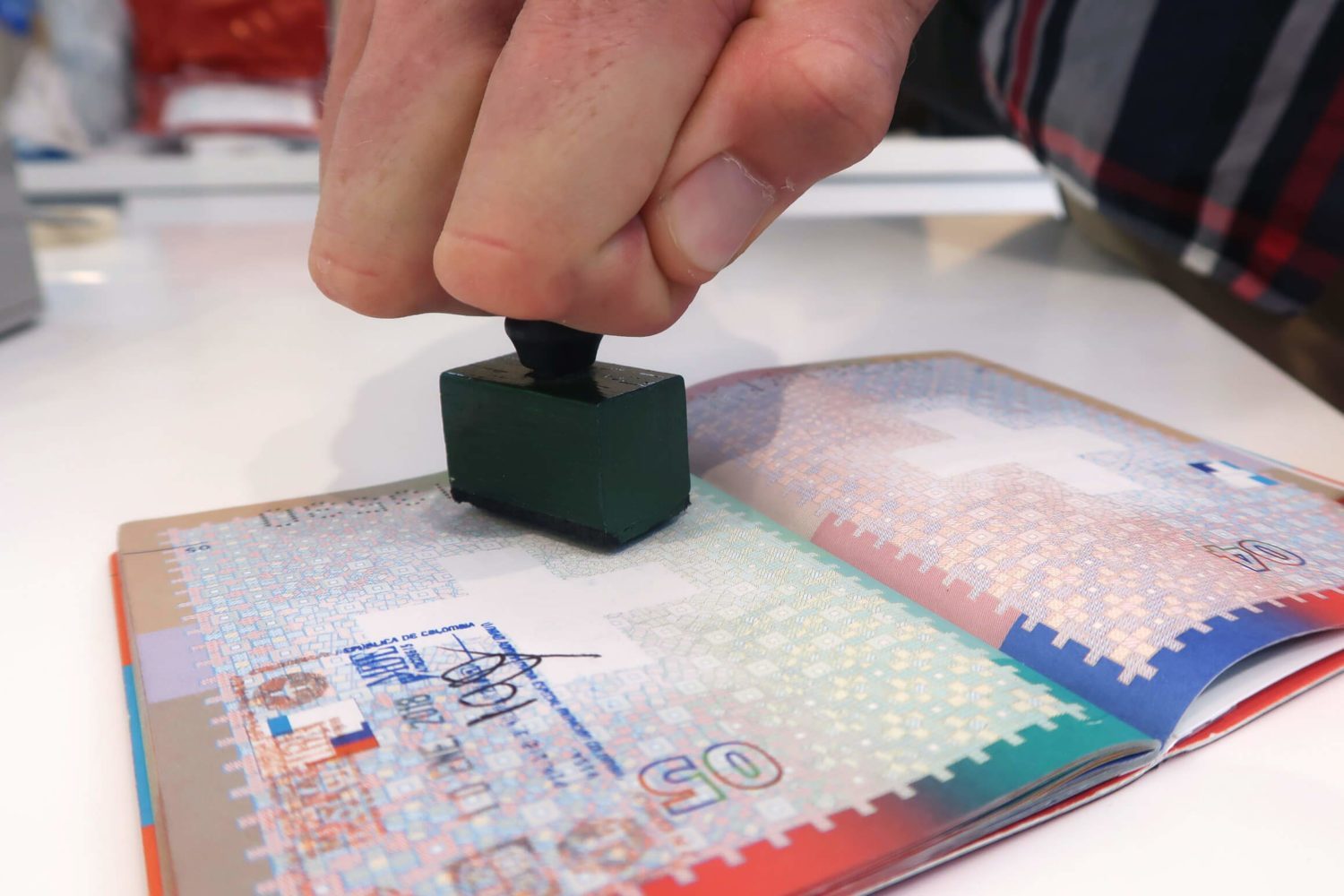 visa being stamped in the passport
